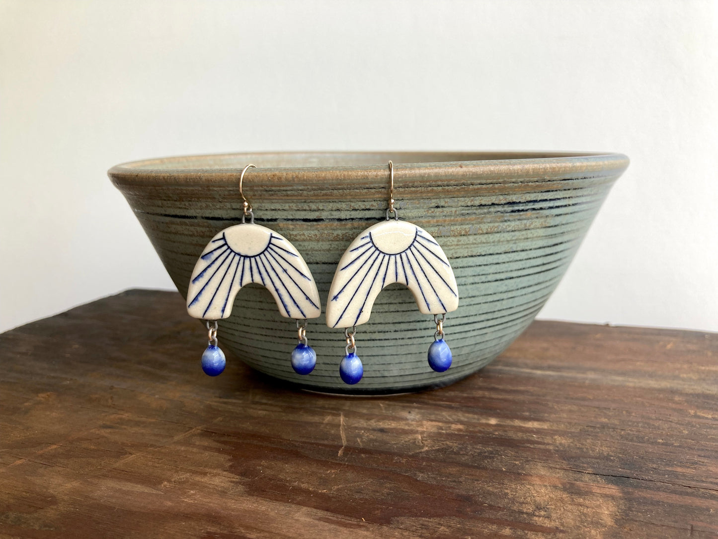 Sunburst Arch Earrings with Blue Dangles