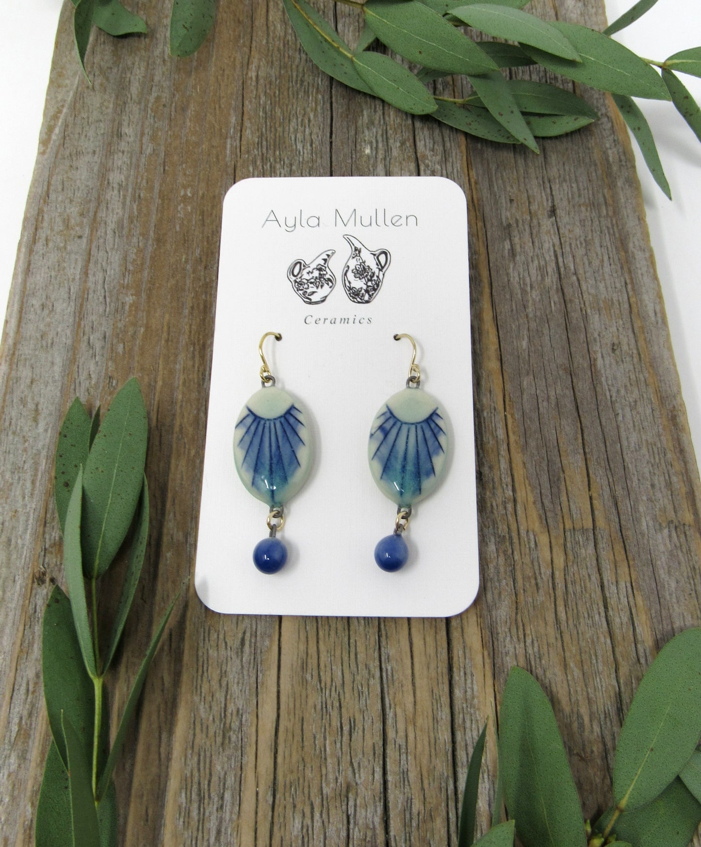 Small Oval Sunburst Earrings with Blue Dangles