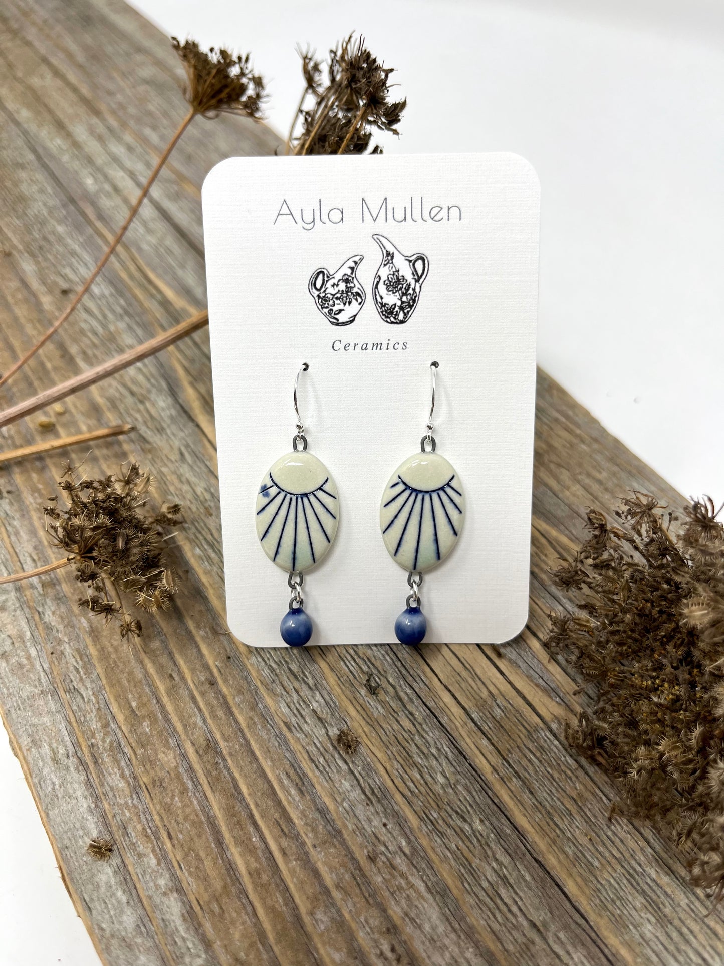 Oval Sunburst Earrings with Blue Dangles