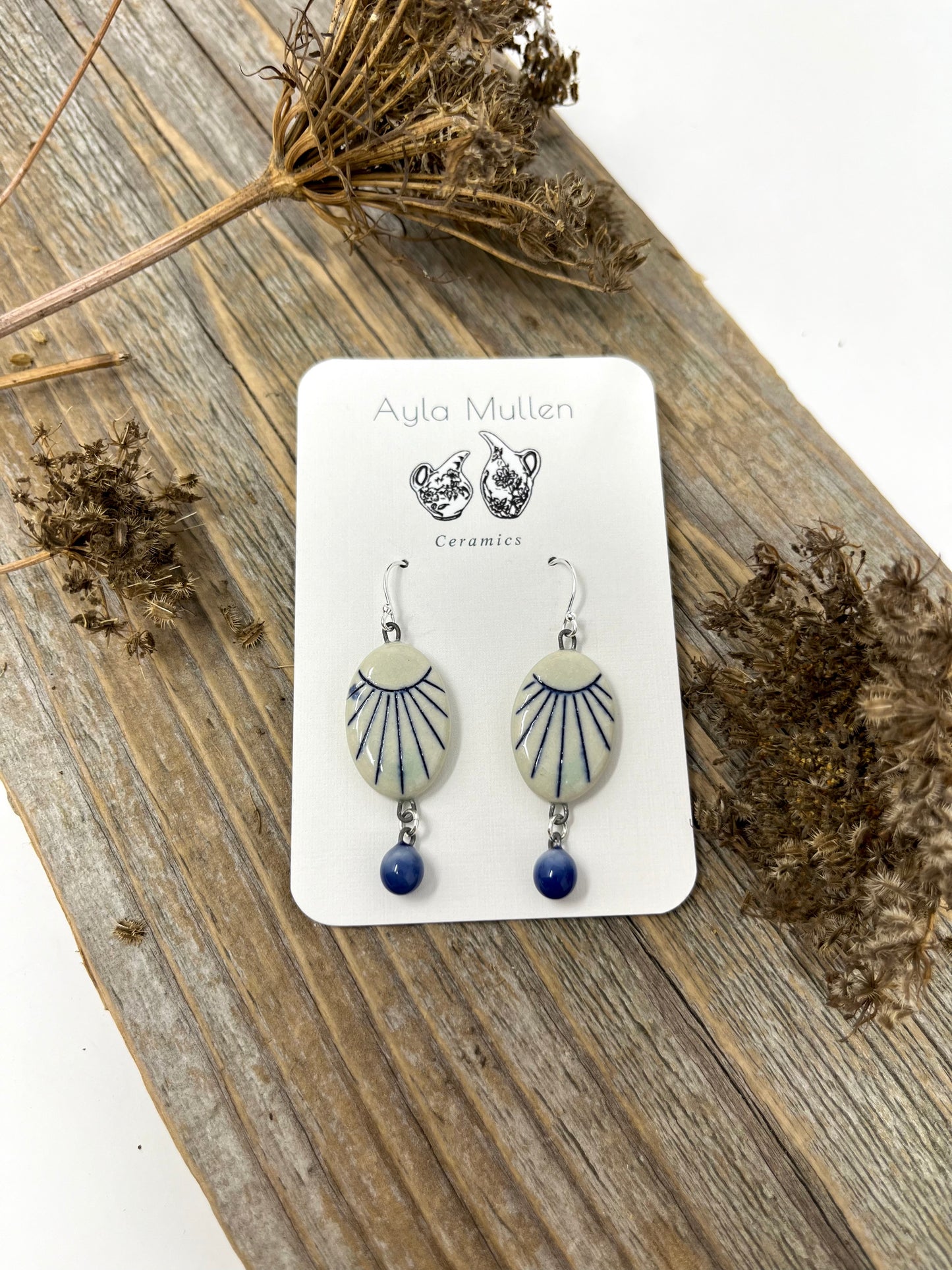 Oval Sunburst Earrings with Blue Dangles