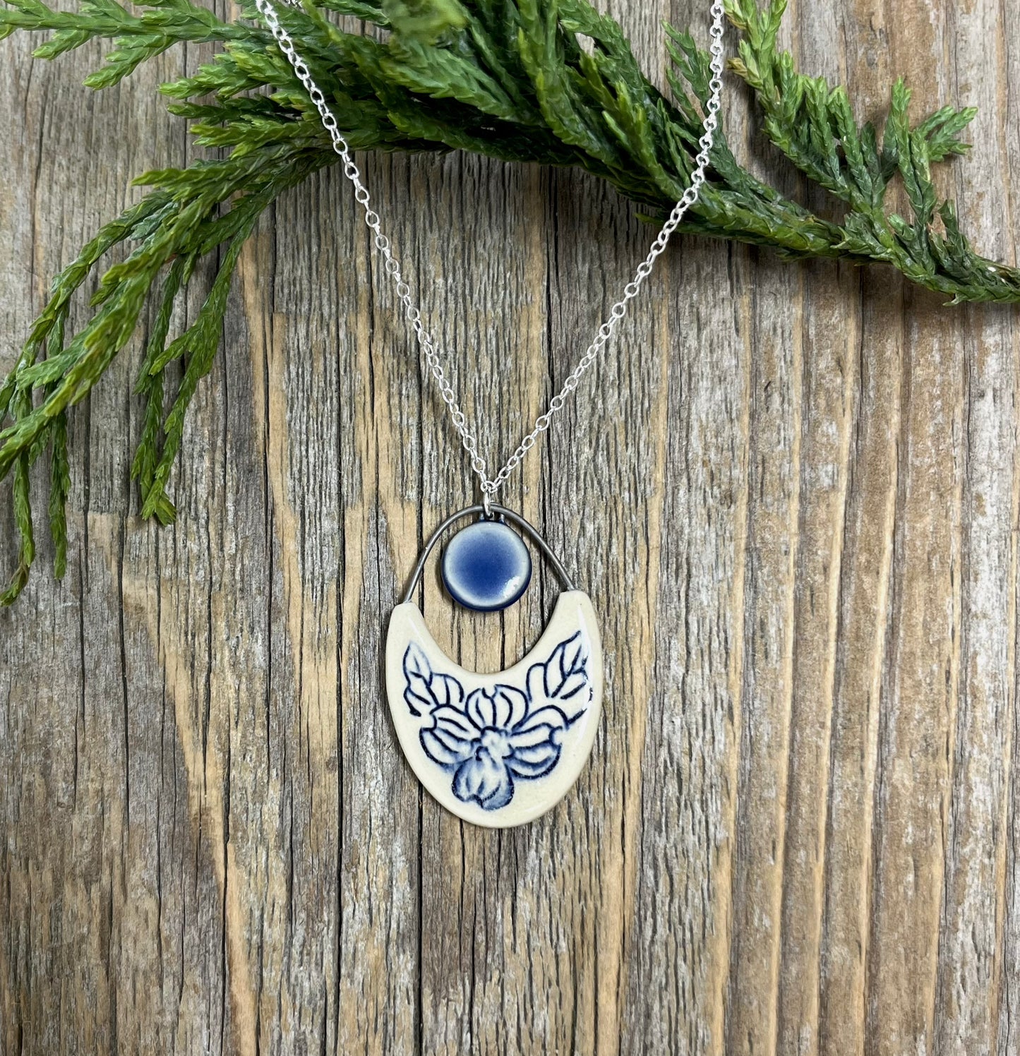 Dogwood Cutout Pendant with cobalt drop