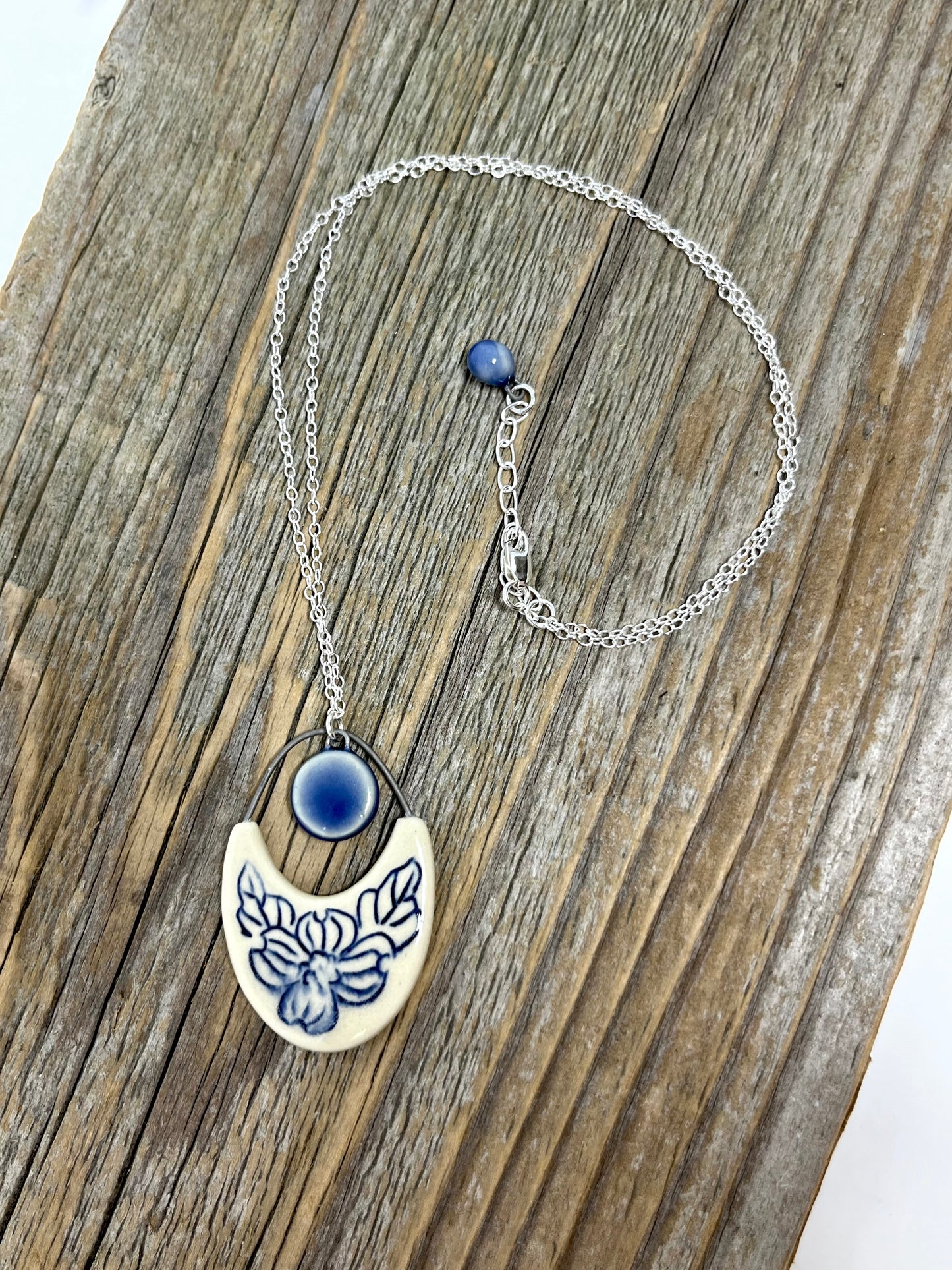 Dogwood Cutout Pendant with cobalt drop