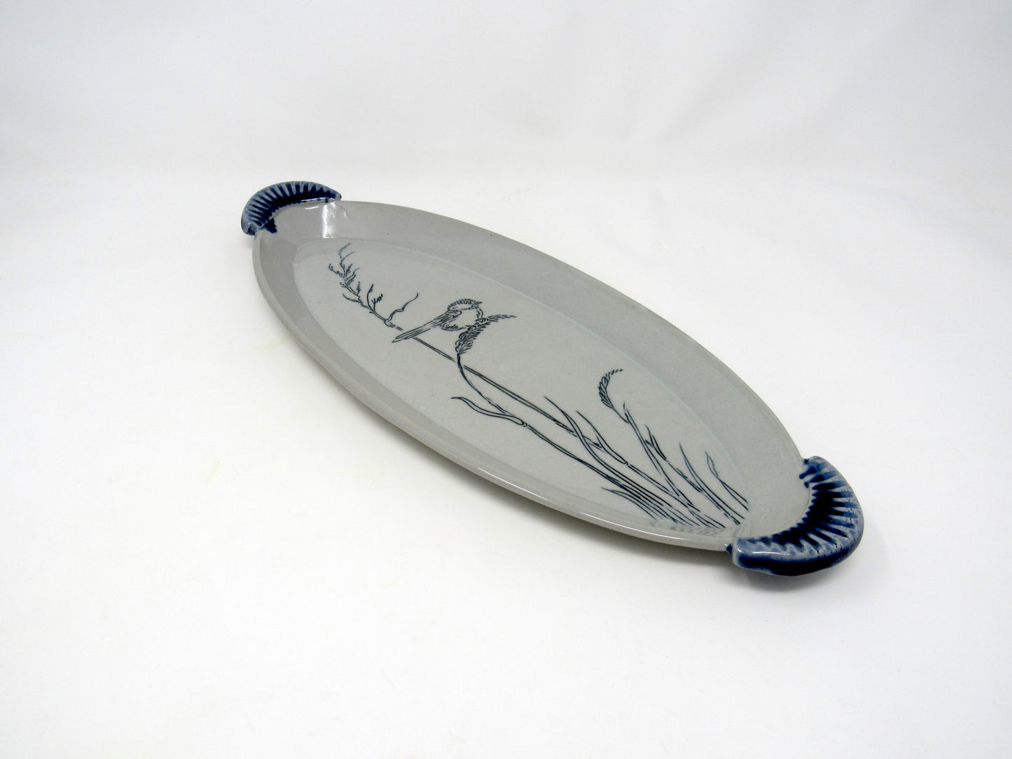 Oval Chickadee in the Grass Tray