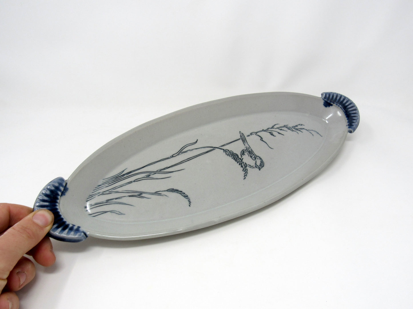 Oval Chickadee in the Grass Tray